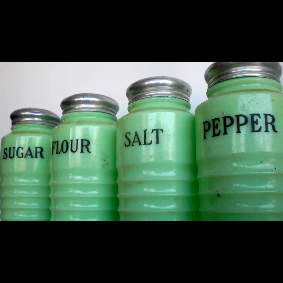 Old sugar, flour, salt and pepper shakers