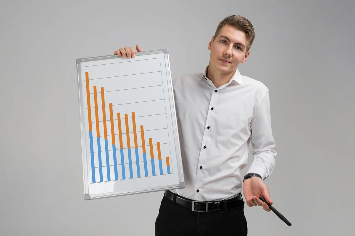Teen holding up a statistics chart