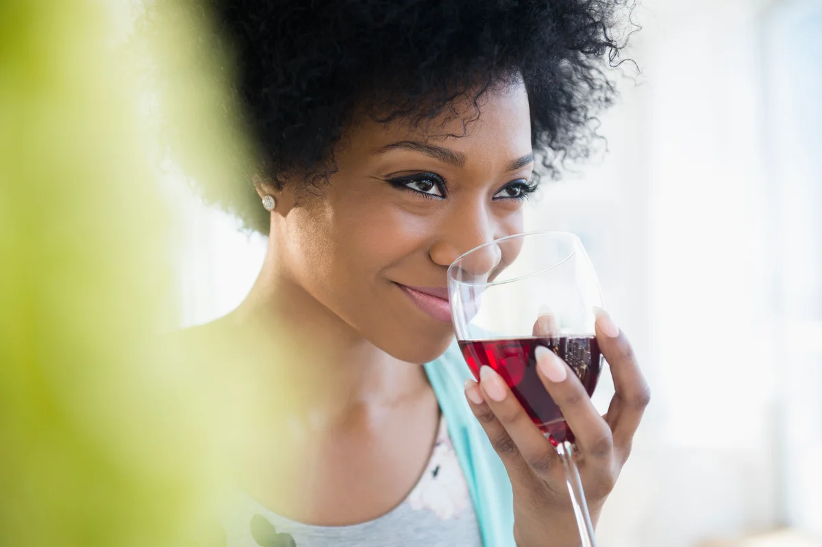 Woman sniffing red wine