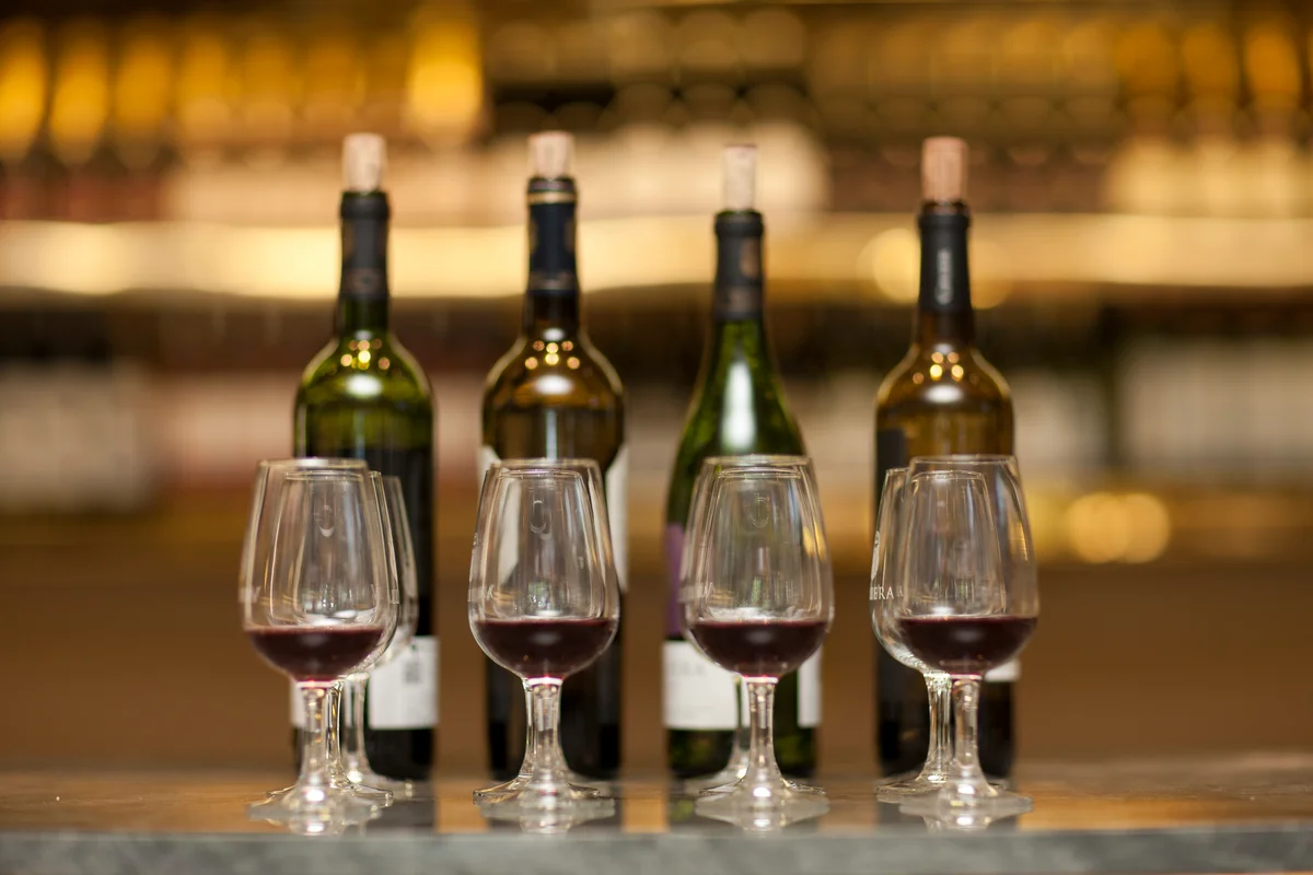 Red wine bottles and glasses