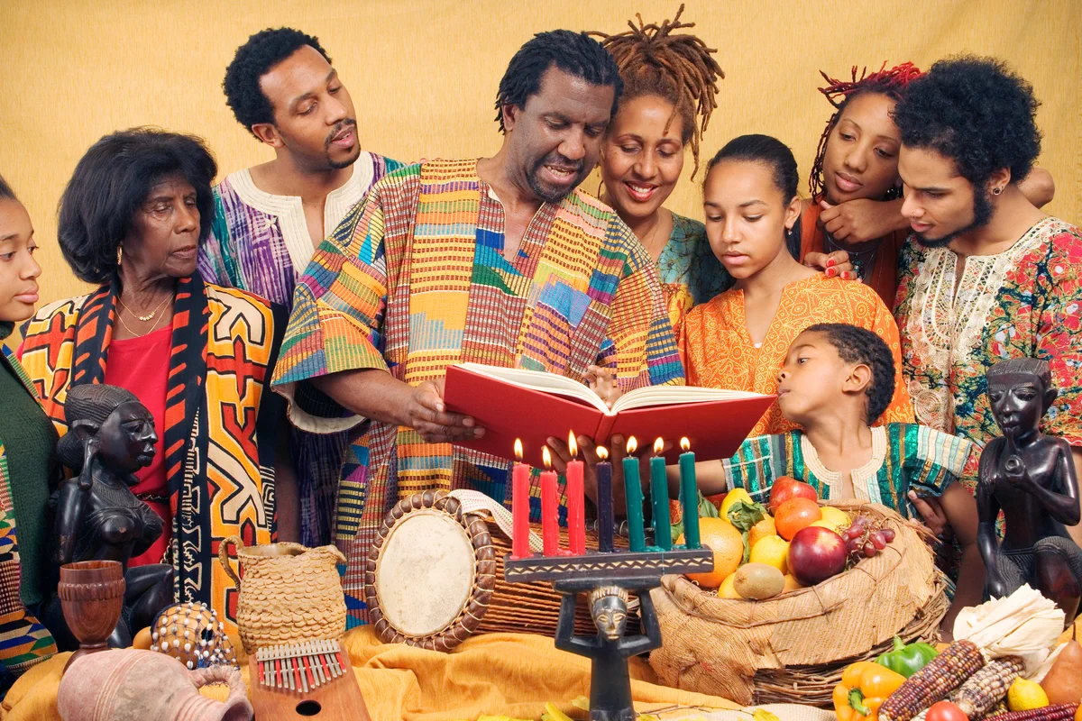 Family lighting candles celebrating Kwanzaa