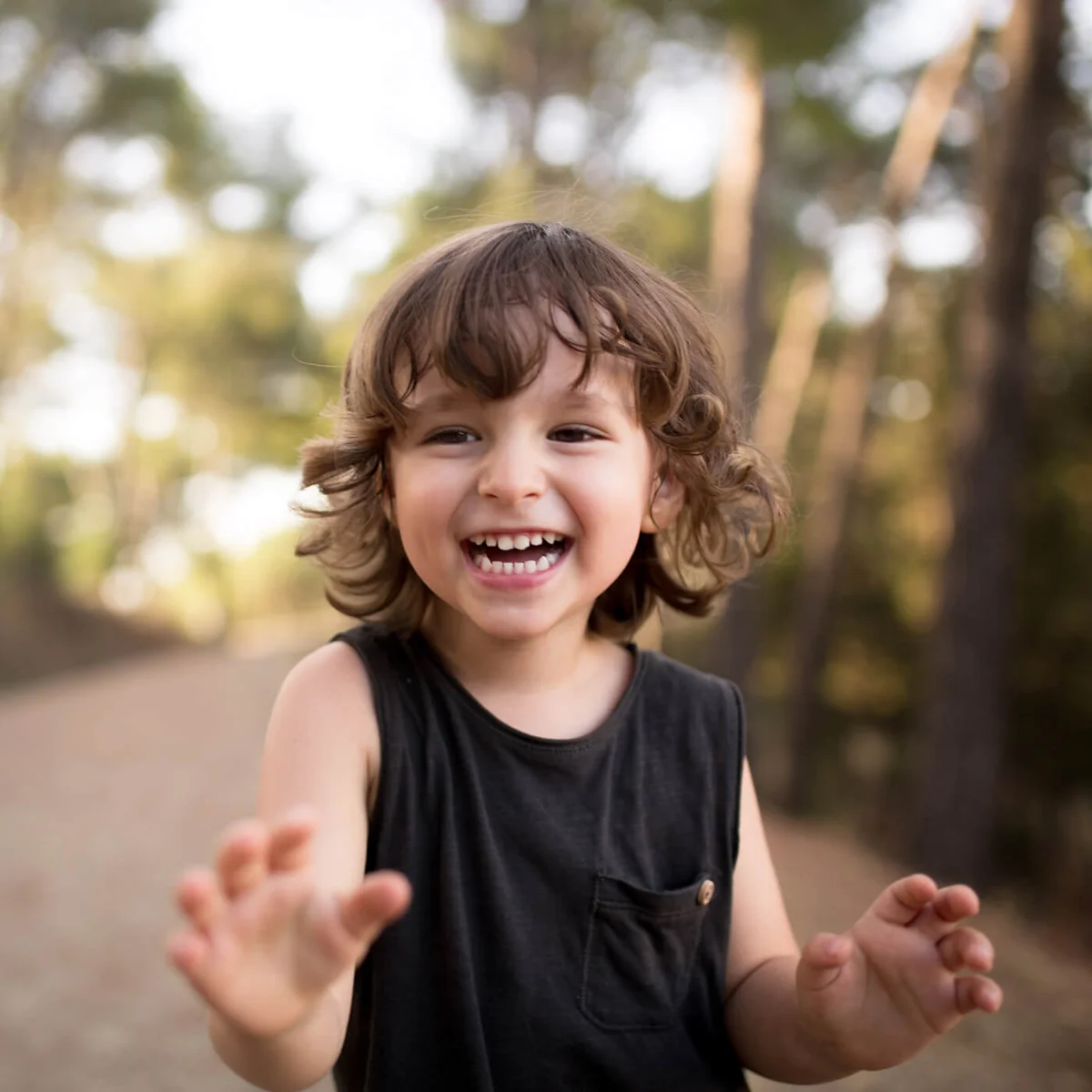 Toddler laughing towards camera