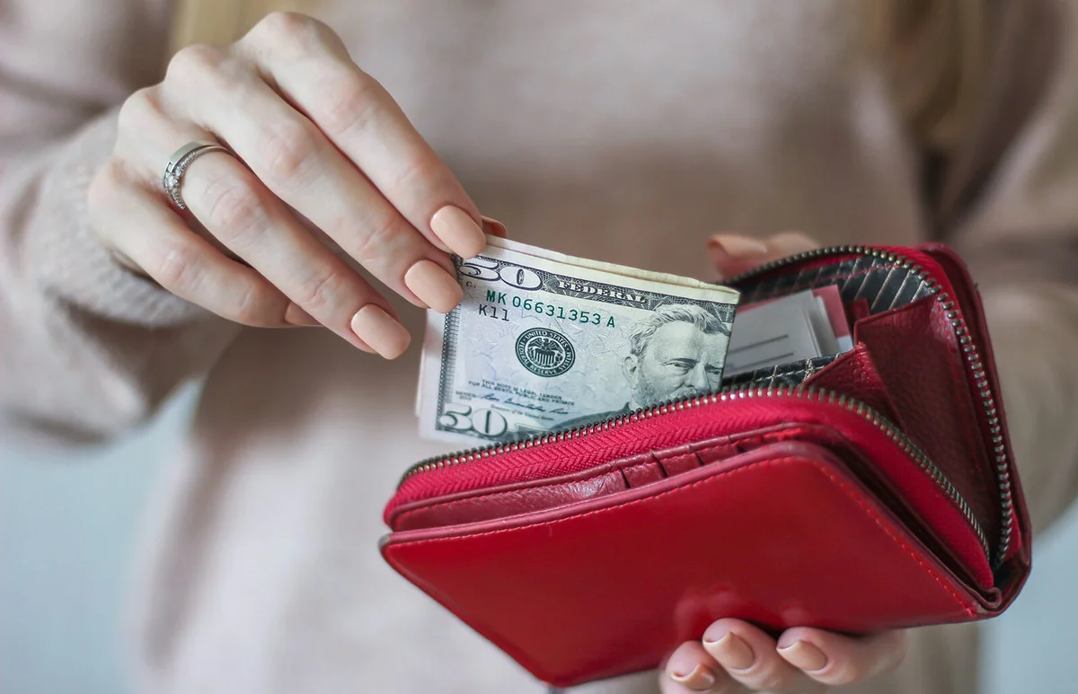 Midsection Of Woman Holding Purse