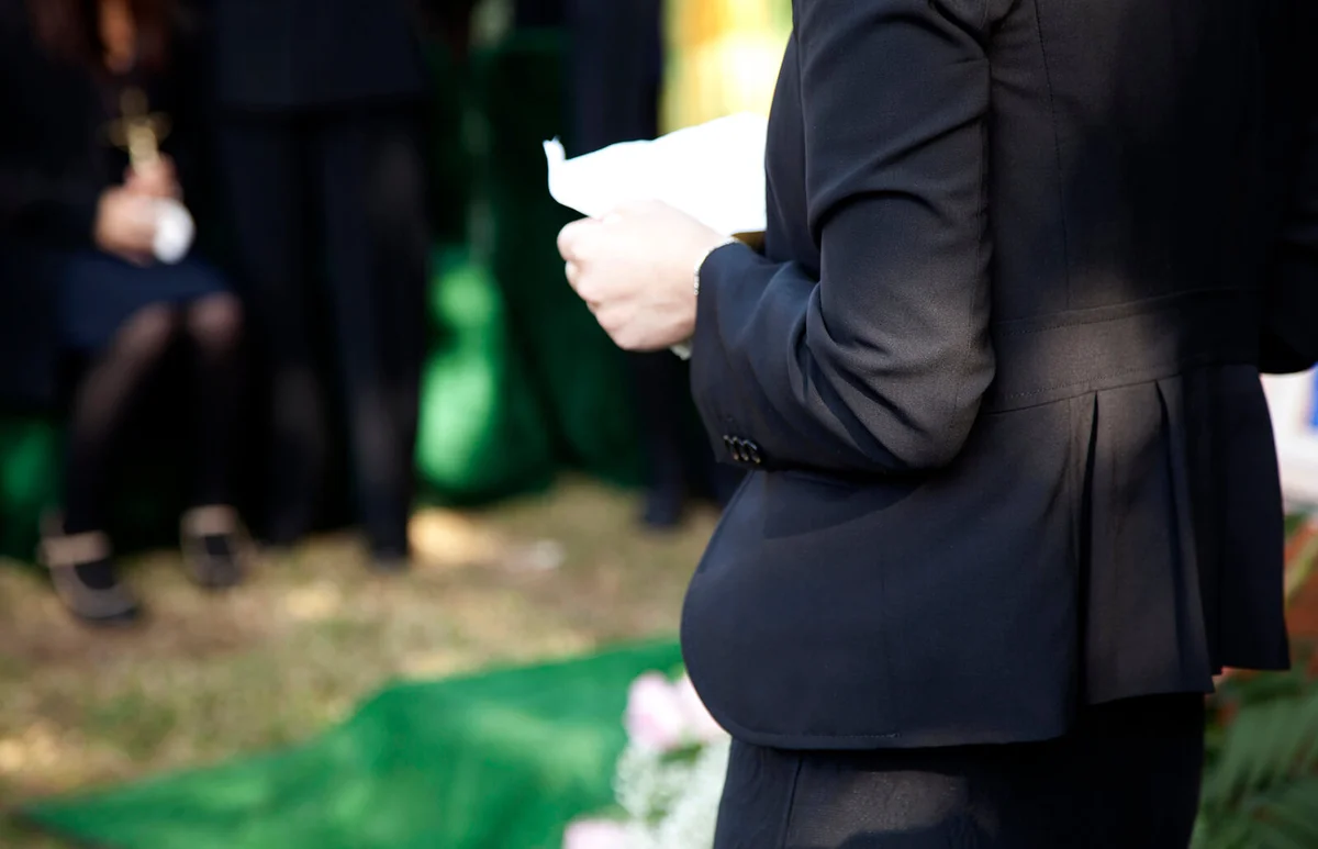 shot of woman reading eulogy