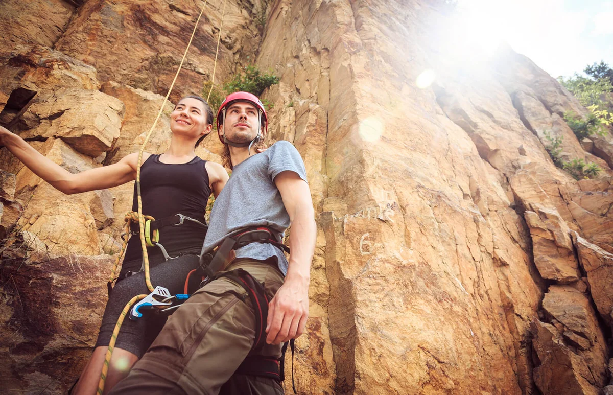 Young Couple Against Cliff