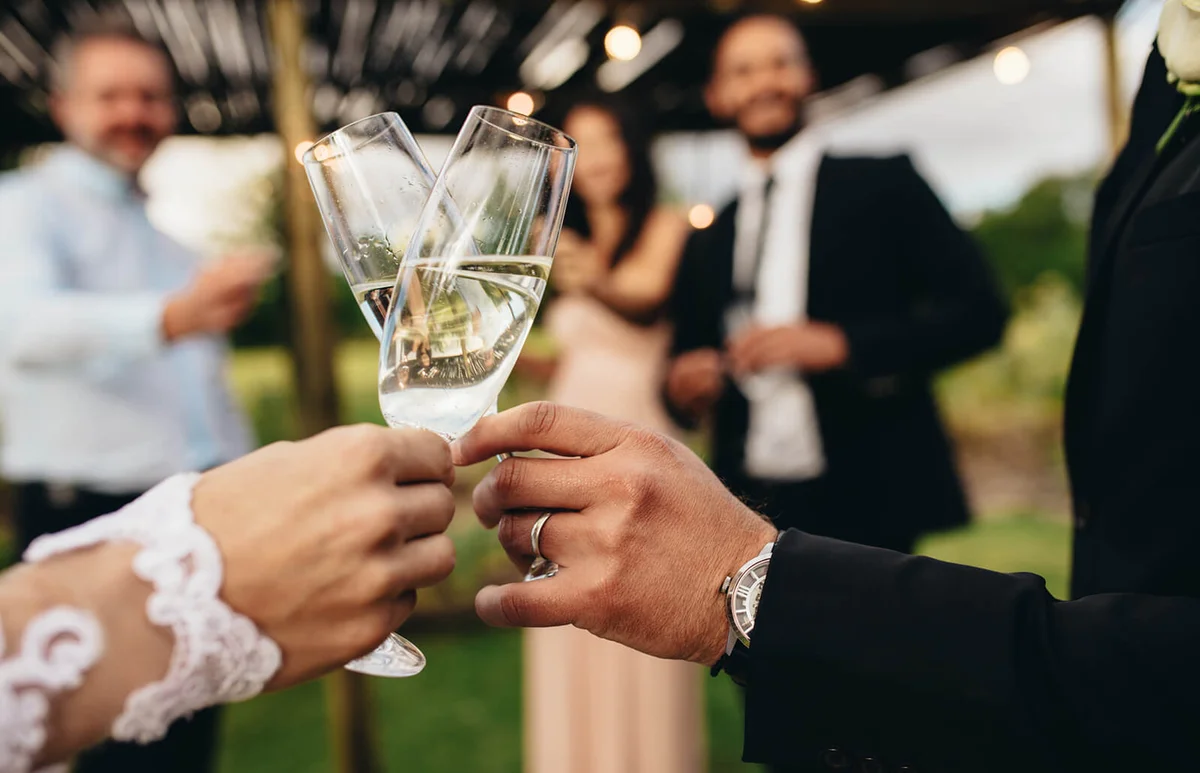 Bride and groom with glasses of champagne