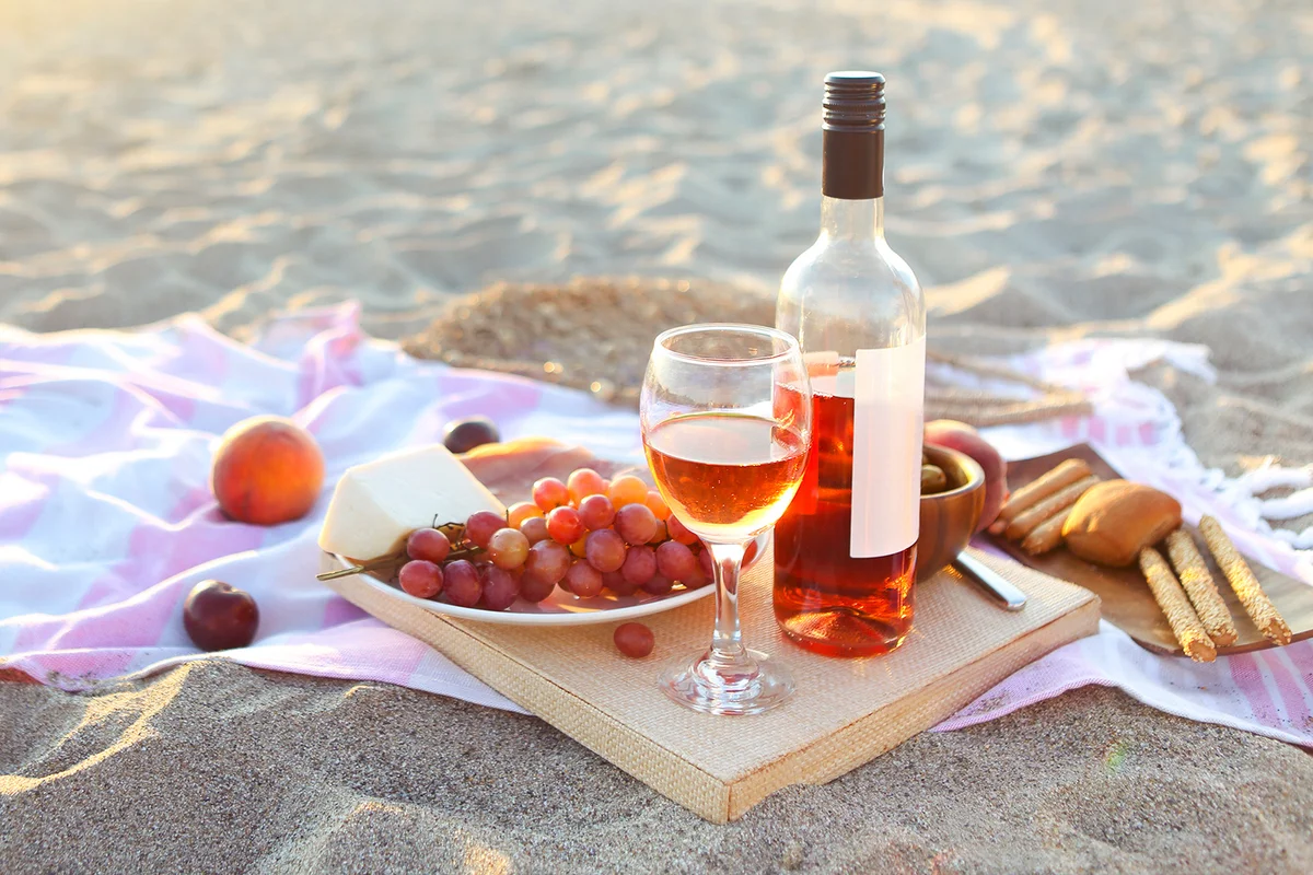 Beach picnic with rosé wine