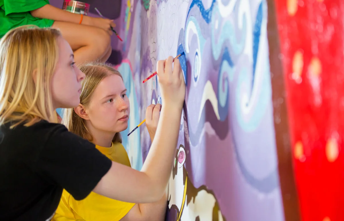 Girl painting mural