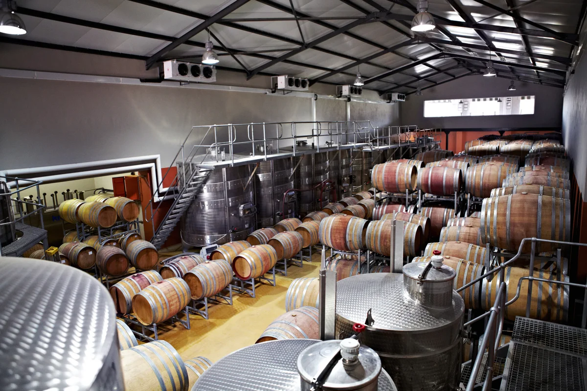 Wine barrels and fermentation vessels in a factory
