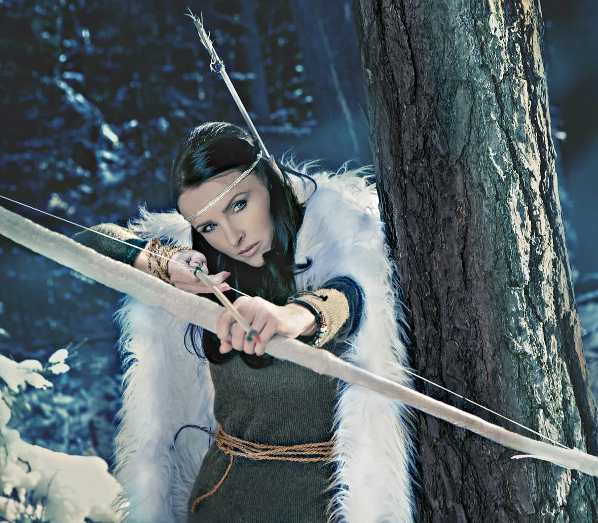 Woman Wearing Costume Holding Bow And Arrow