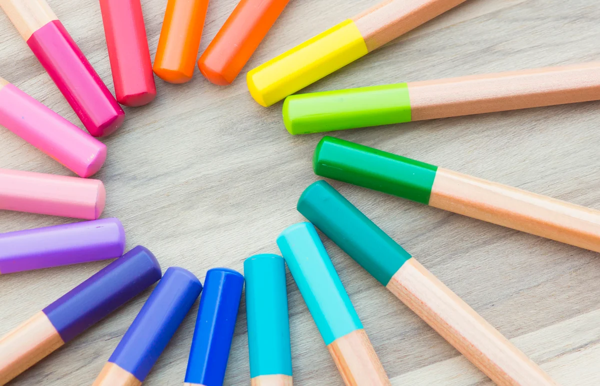 Coloured pencils arranged to form a circle