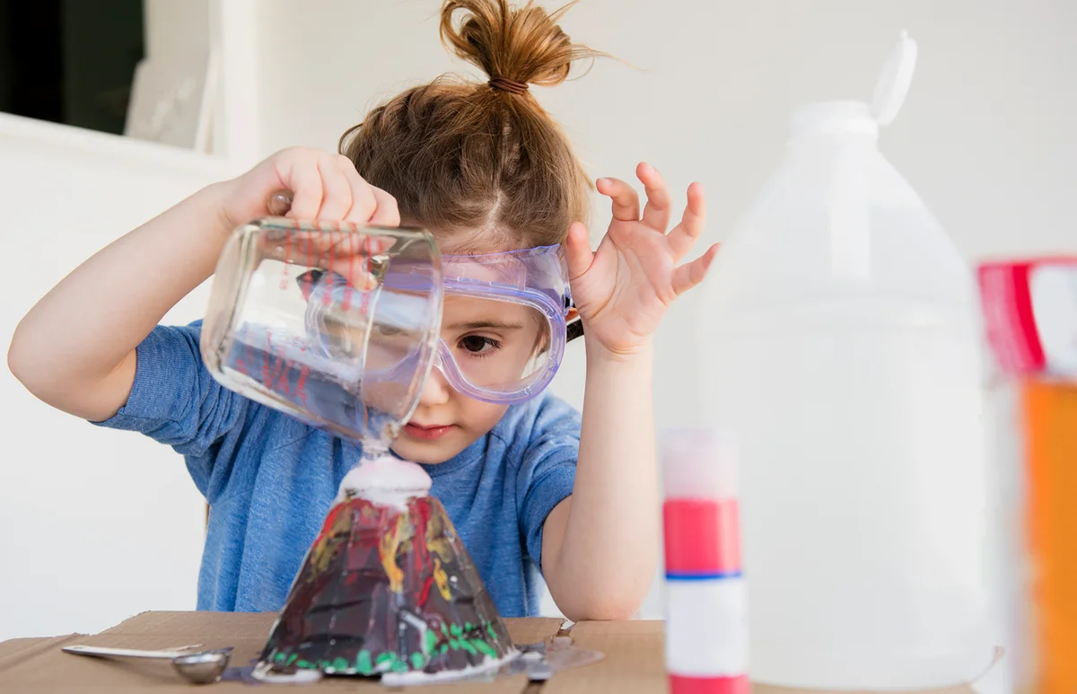 Girl making volcano