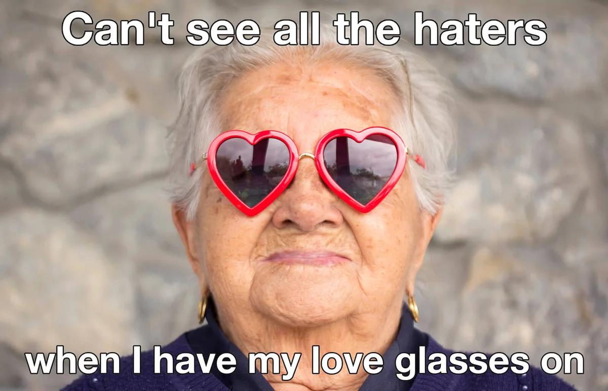 Old woman with sunglasses with heart shape