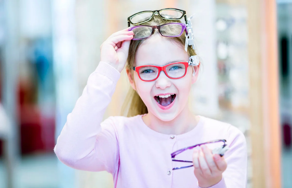 Girl trying on glasses