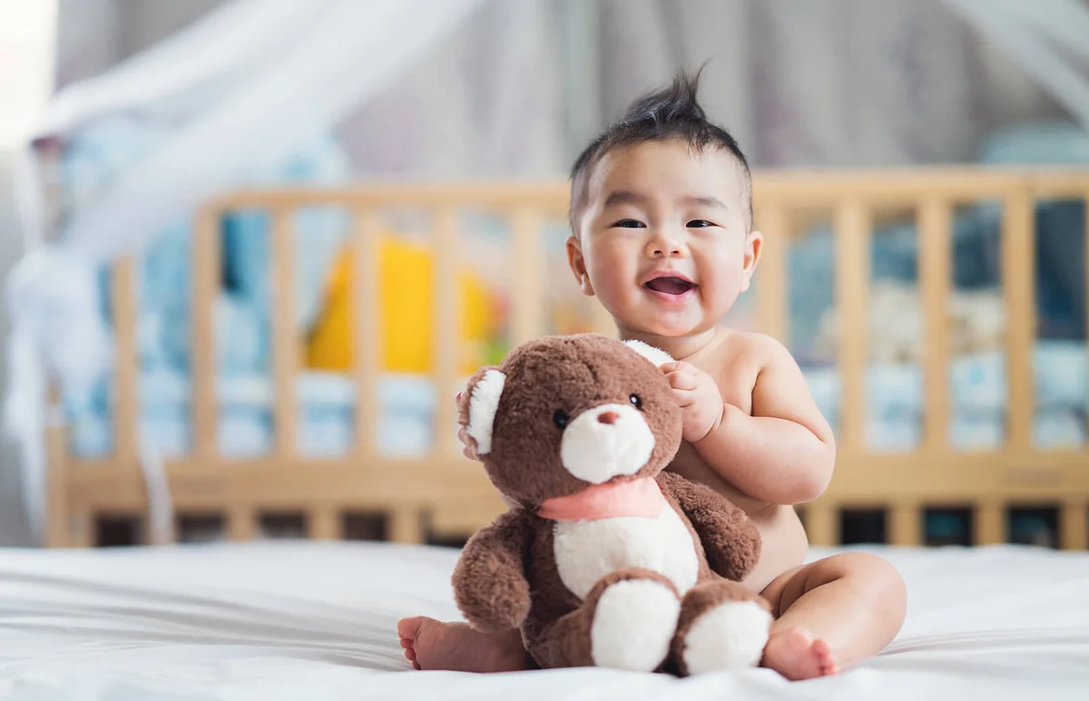baby sit with teddy bear
