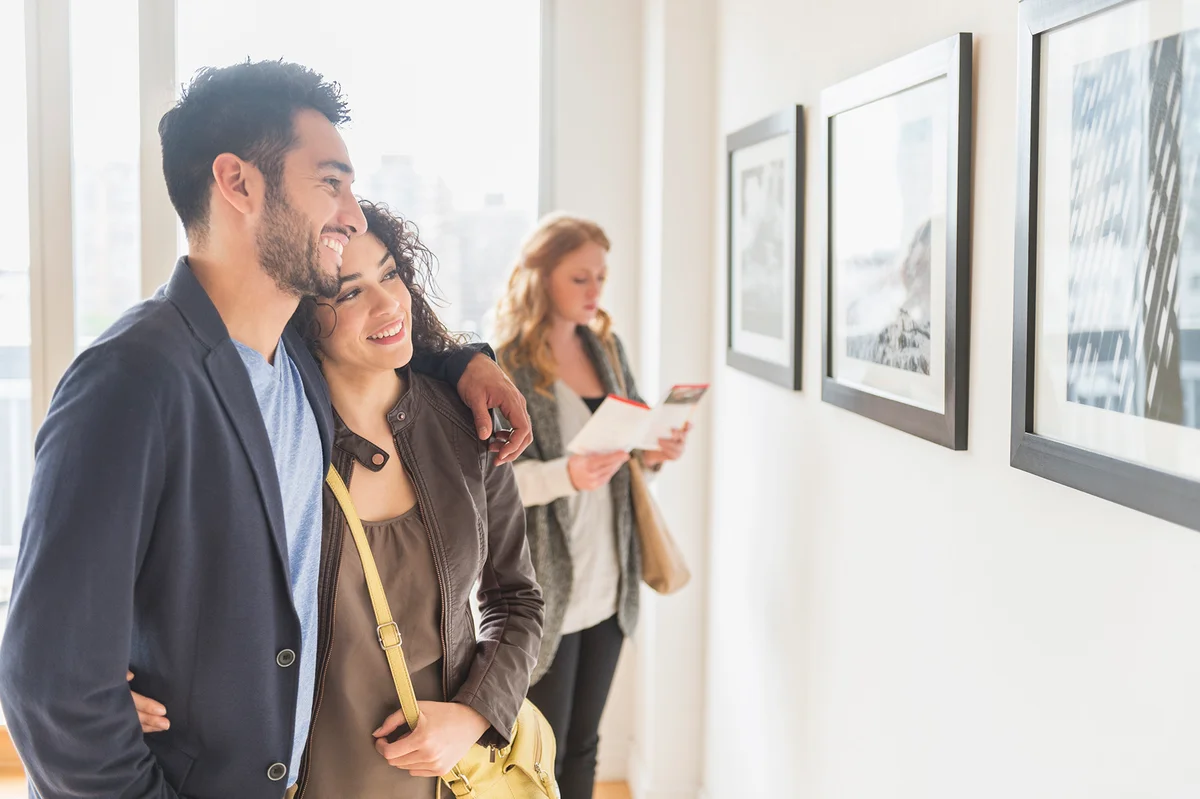 Couple admiring art in gallery