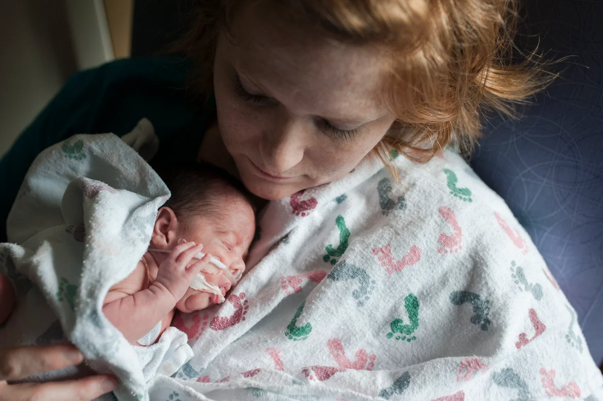 NICU baby is nurtured by mother