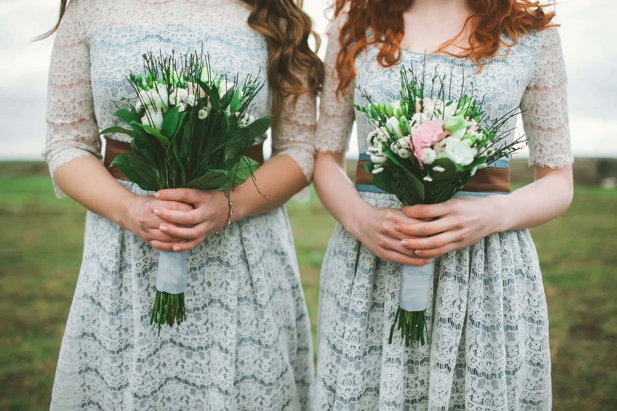 Bridesmaids holding a bouquet of flowers