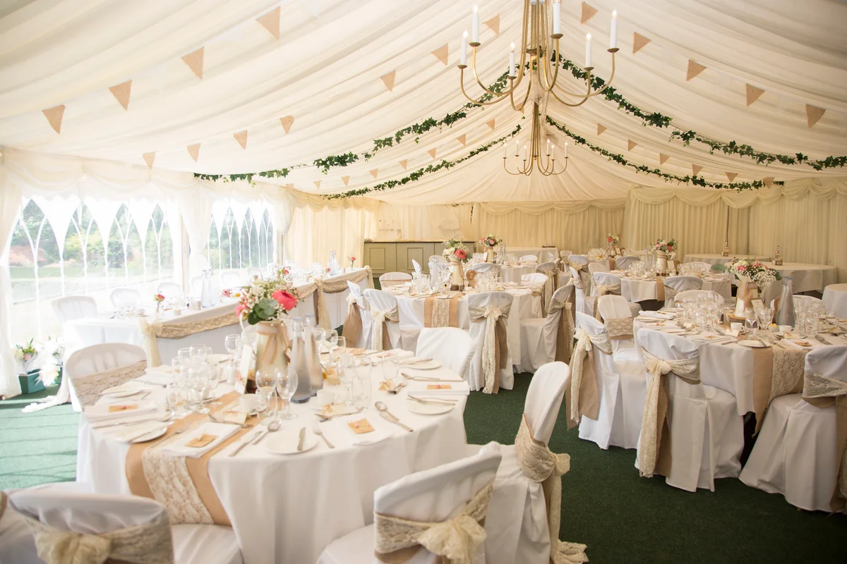 Wedding reception tables under tent