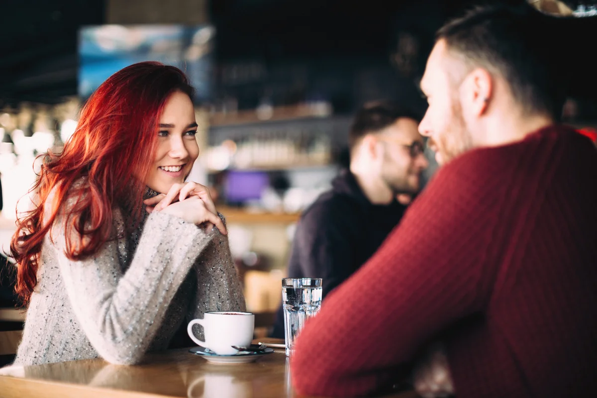 young couple having coffee in restaurant