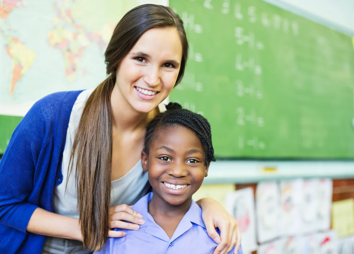 Student and teacher smiling in class