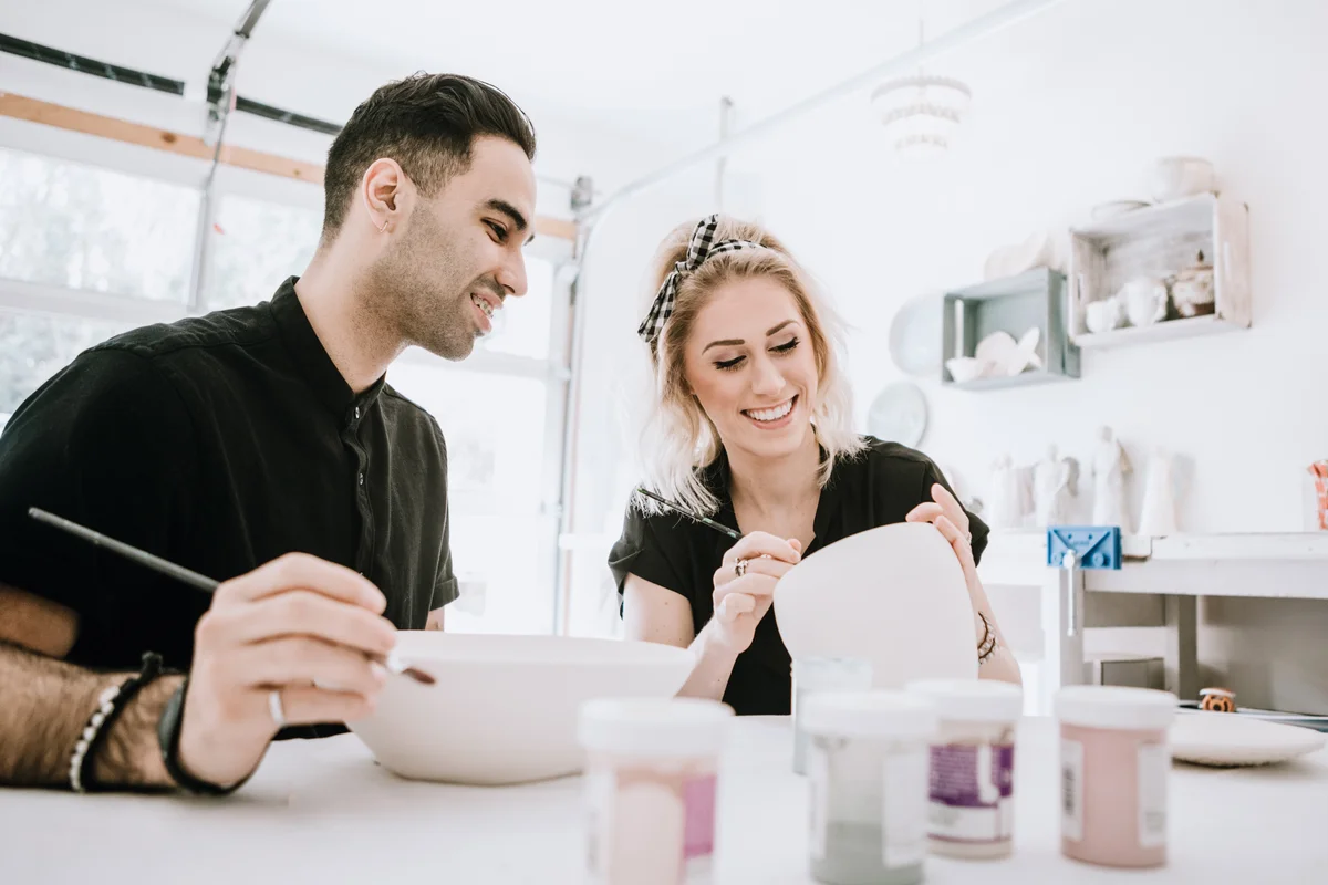 Couple painting pottery