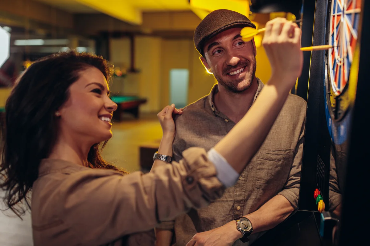 couple playing darts