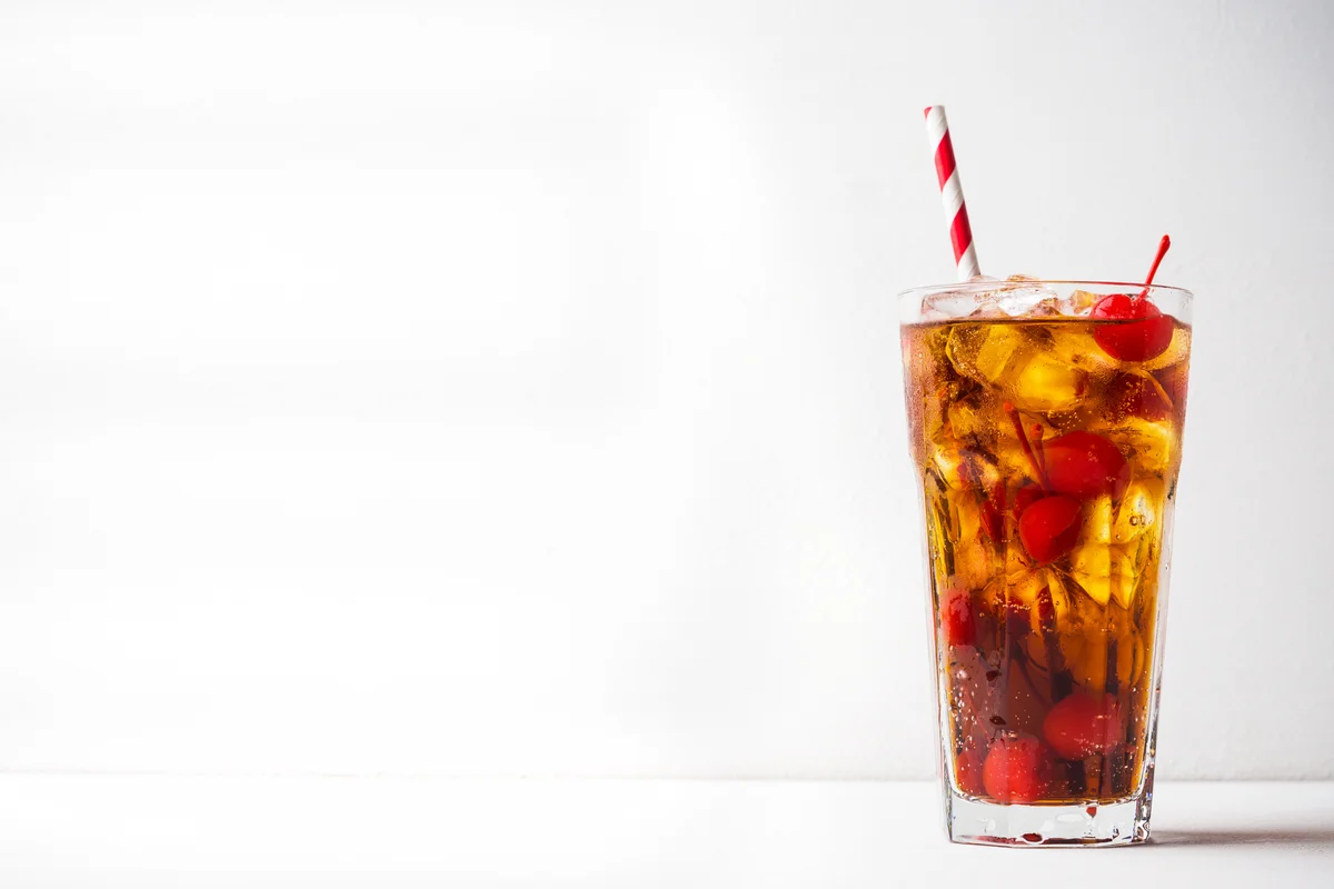 Amaretto and cola garnished with cherries