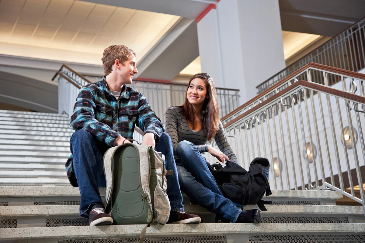 Students on steps of school building