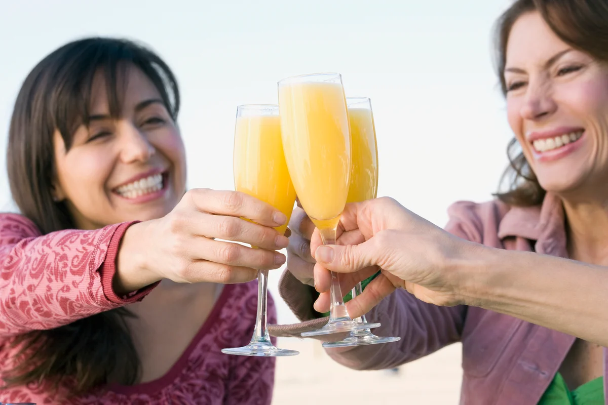 Women toasting with D'Artagnan cocktails