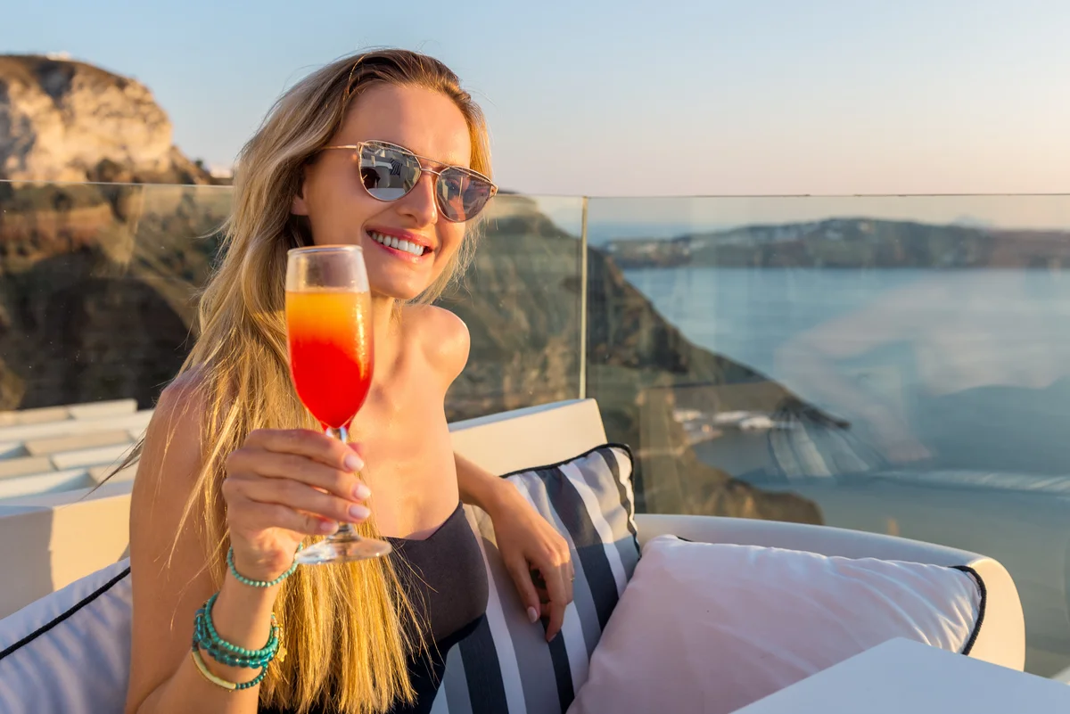 Woman with an orange cocktail