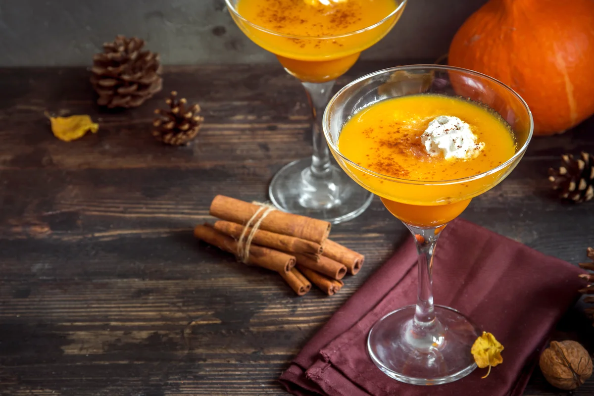 Thanksgiving and Halloween Cocktails. Cocktail with Pumpkin Pie Spices and Whipped Cream