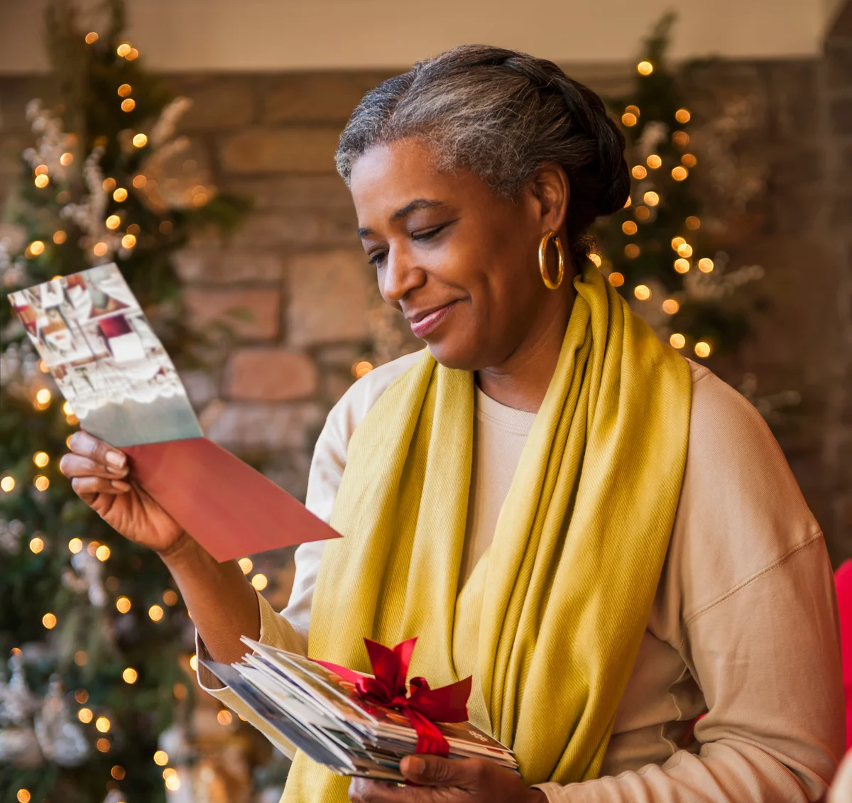 African American woman reading Christmas card
