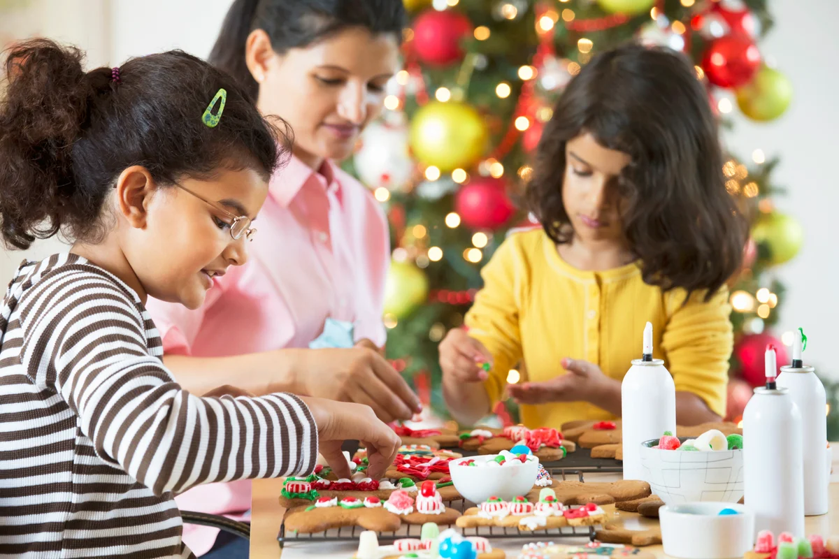 Indian family decorating Christmas cookies