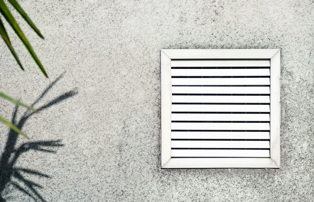 Aged vent with white shutters
