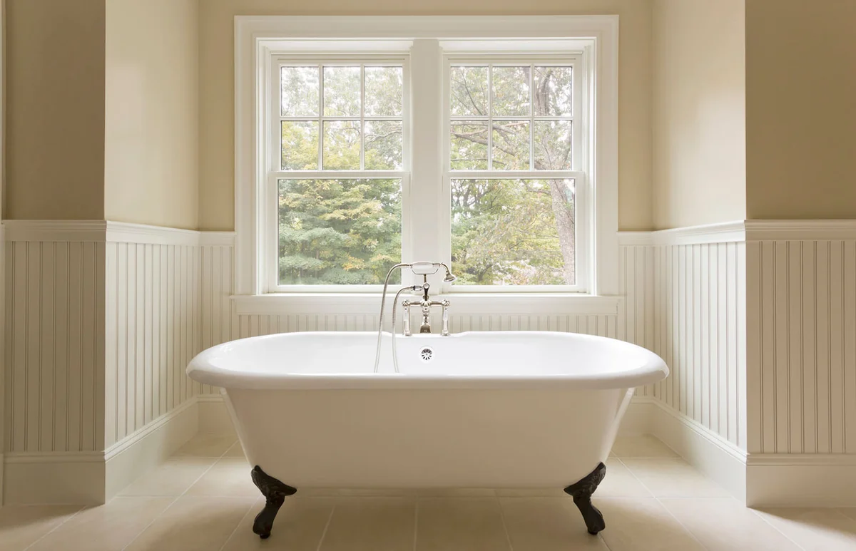 Clawfoot bathtub in custom designed bathroom