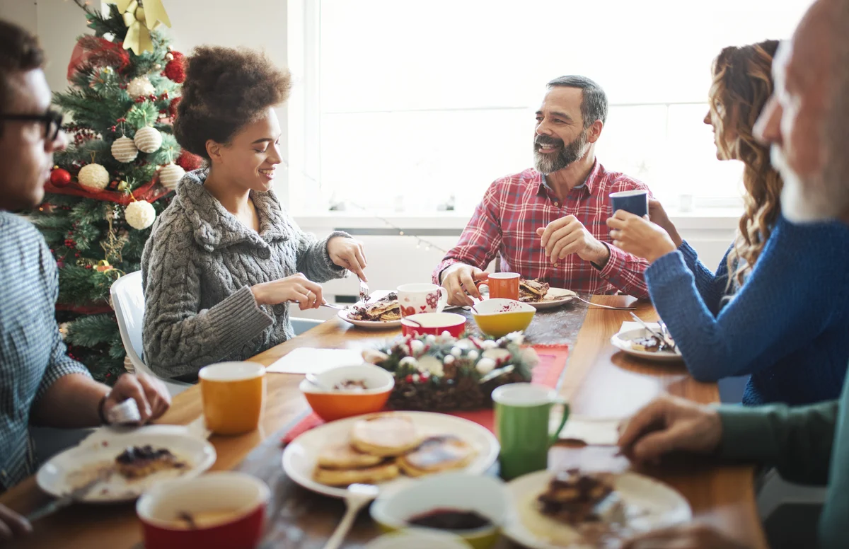 Family having breakfast on Christmas morning. - stock photo