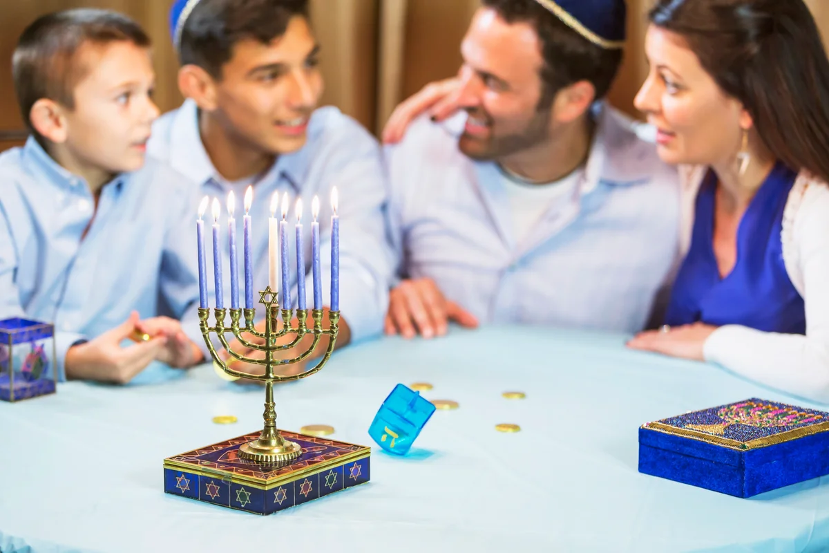 Family of four celebrating hanukkah