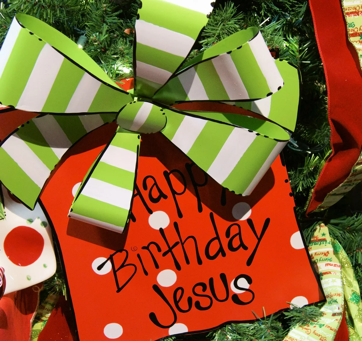 Happy Birthday Jesus spelled out in a decorated Christmas tre