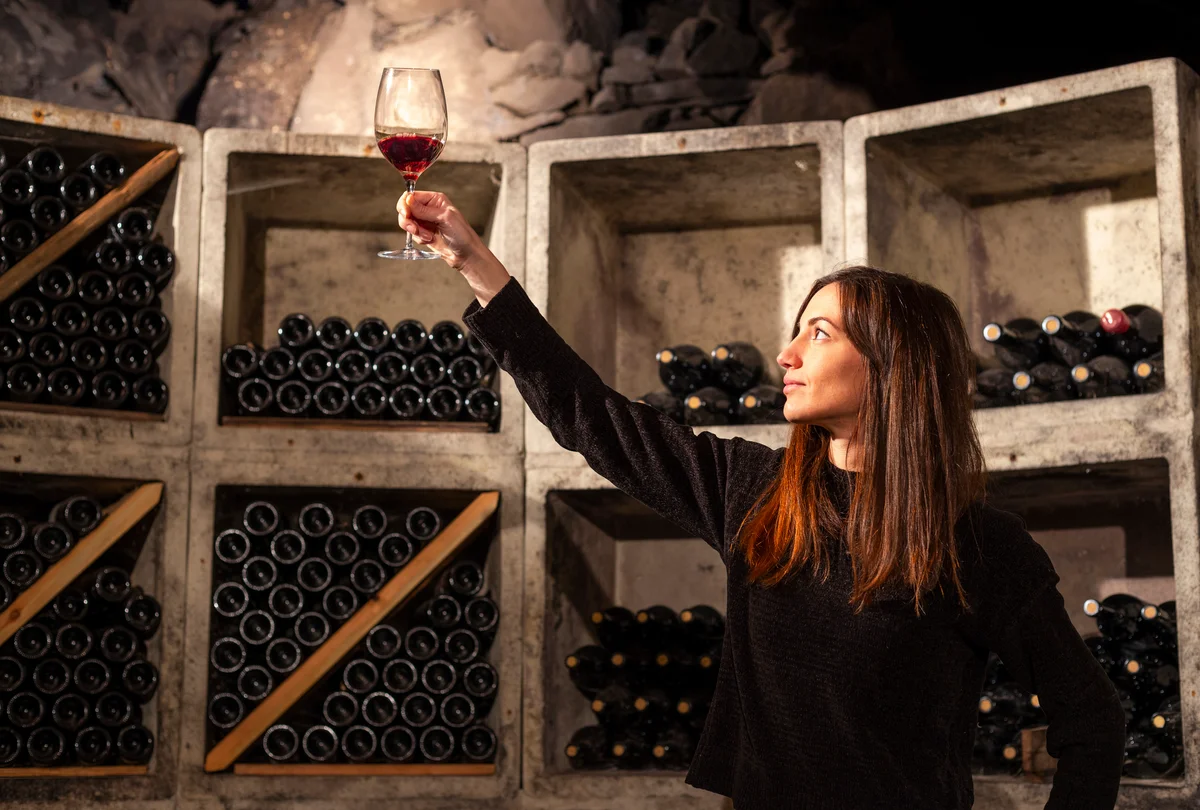 Woman in a wine cellar