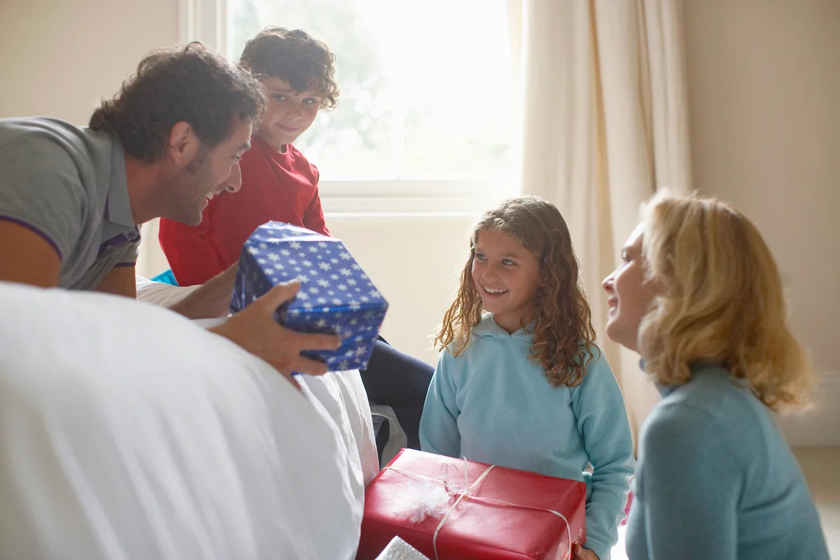 Family opening Christmas gifts