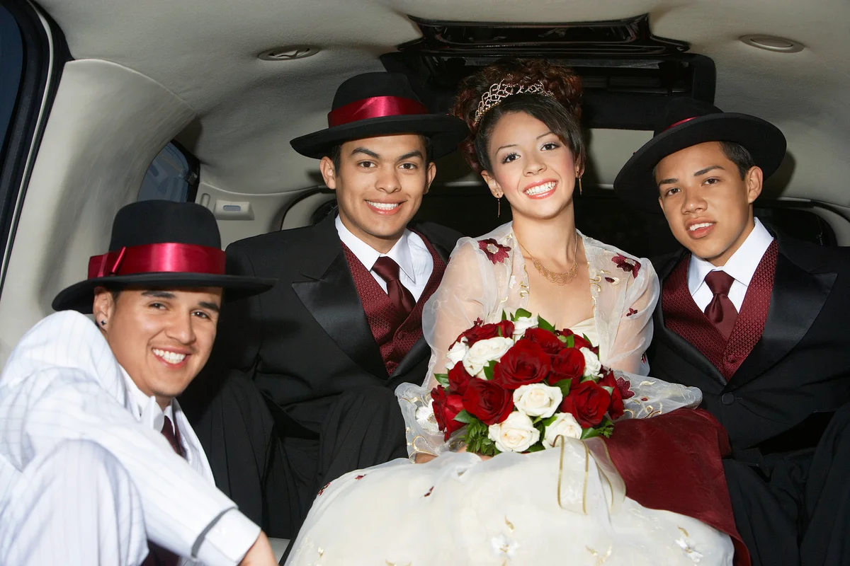 Girl and boys in limousine at Quinceanera