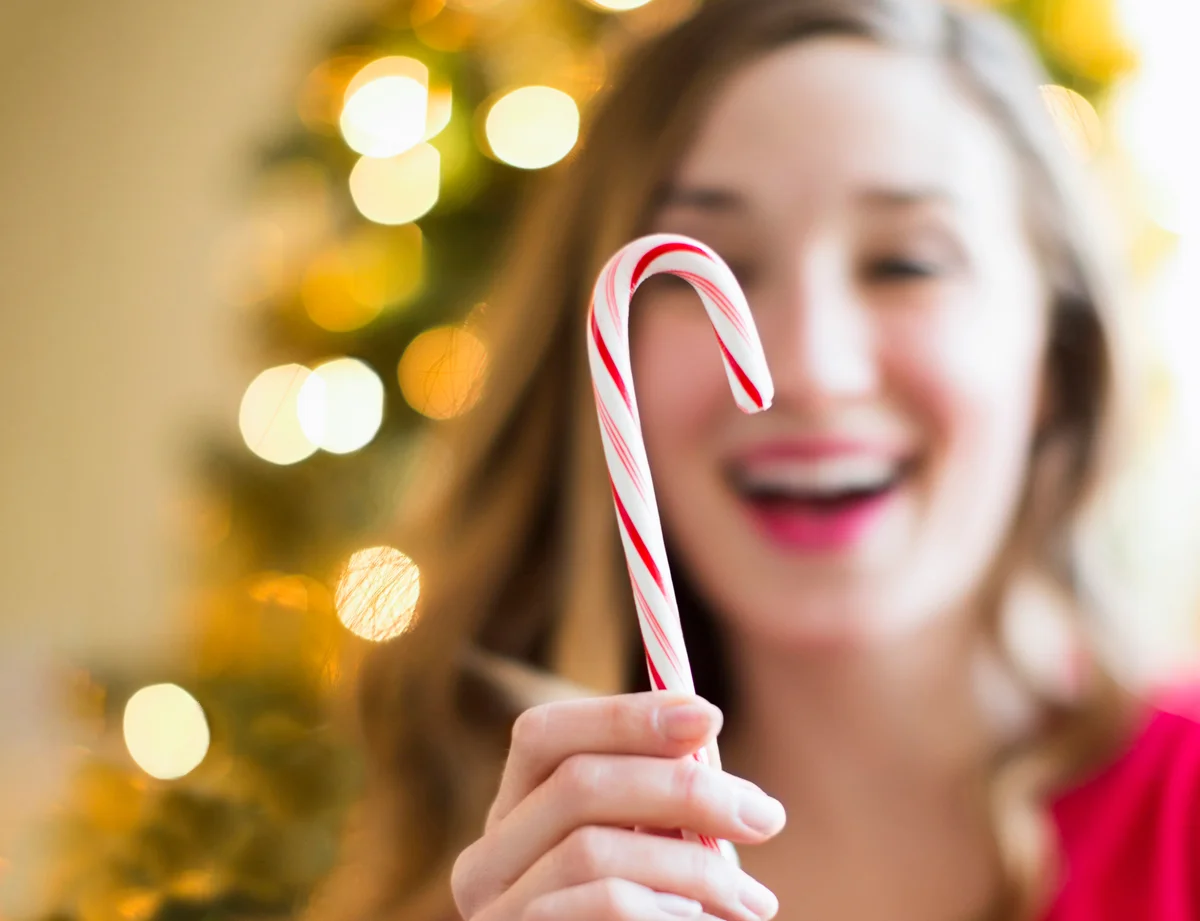 Woman holding candy cane