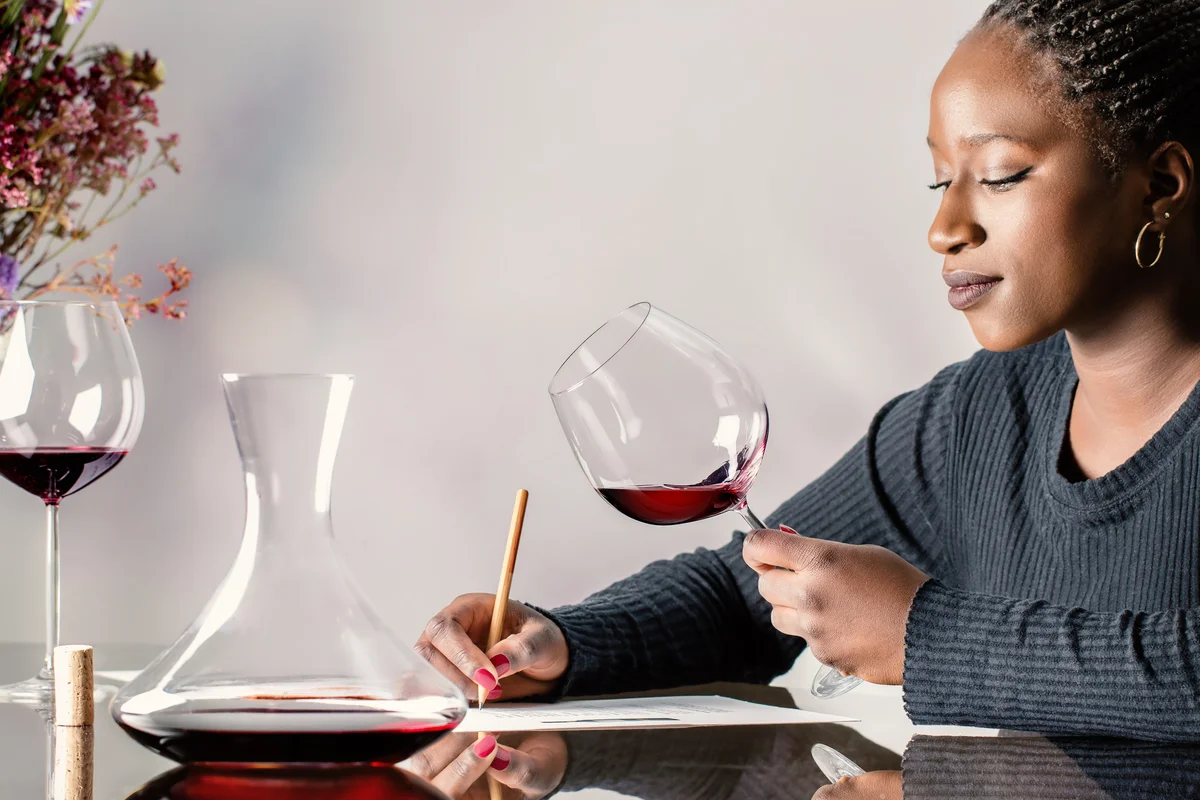 Sommelier evaluating red wine