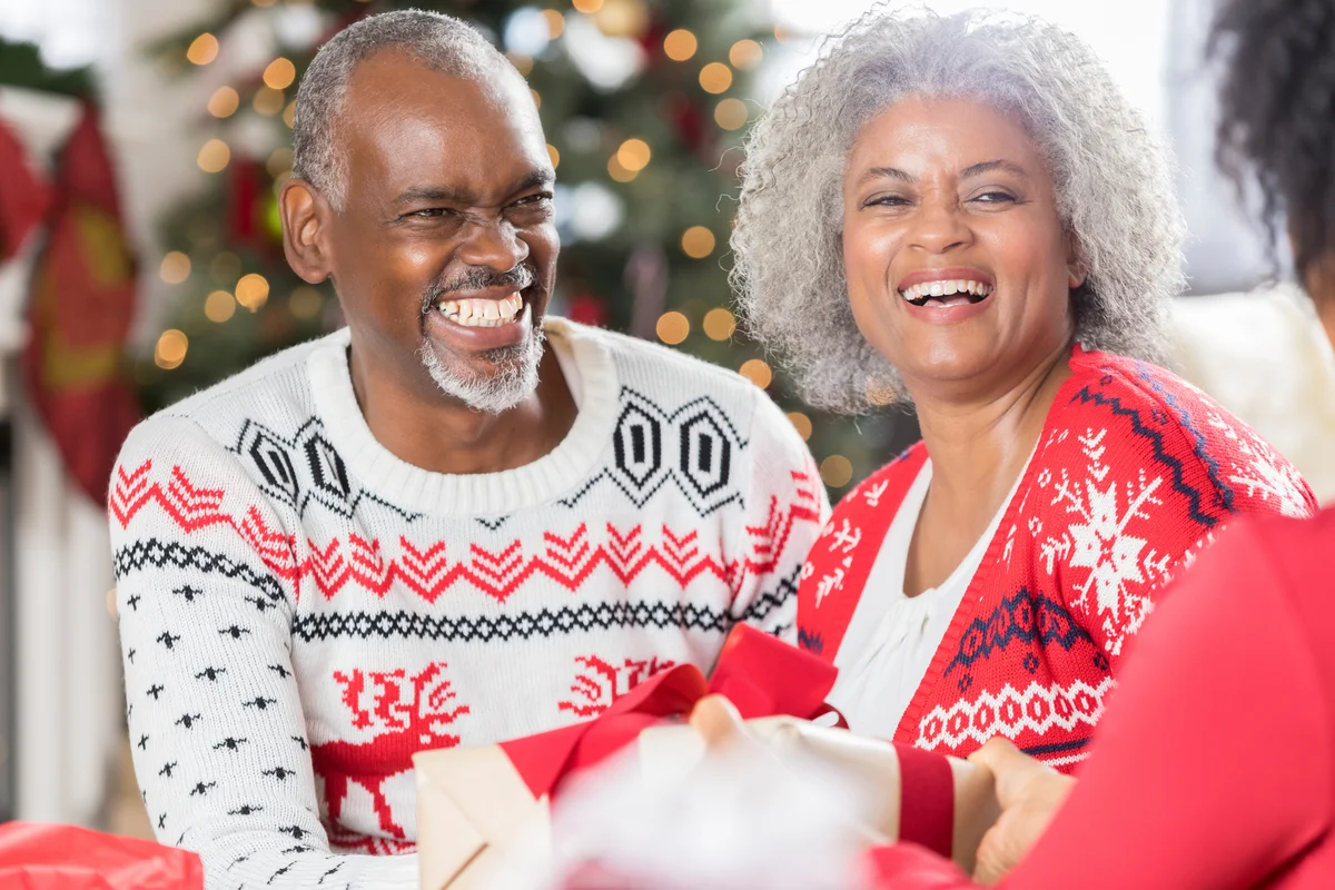 Happy senior couple spending Christmas with family