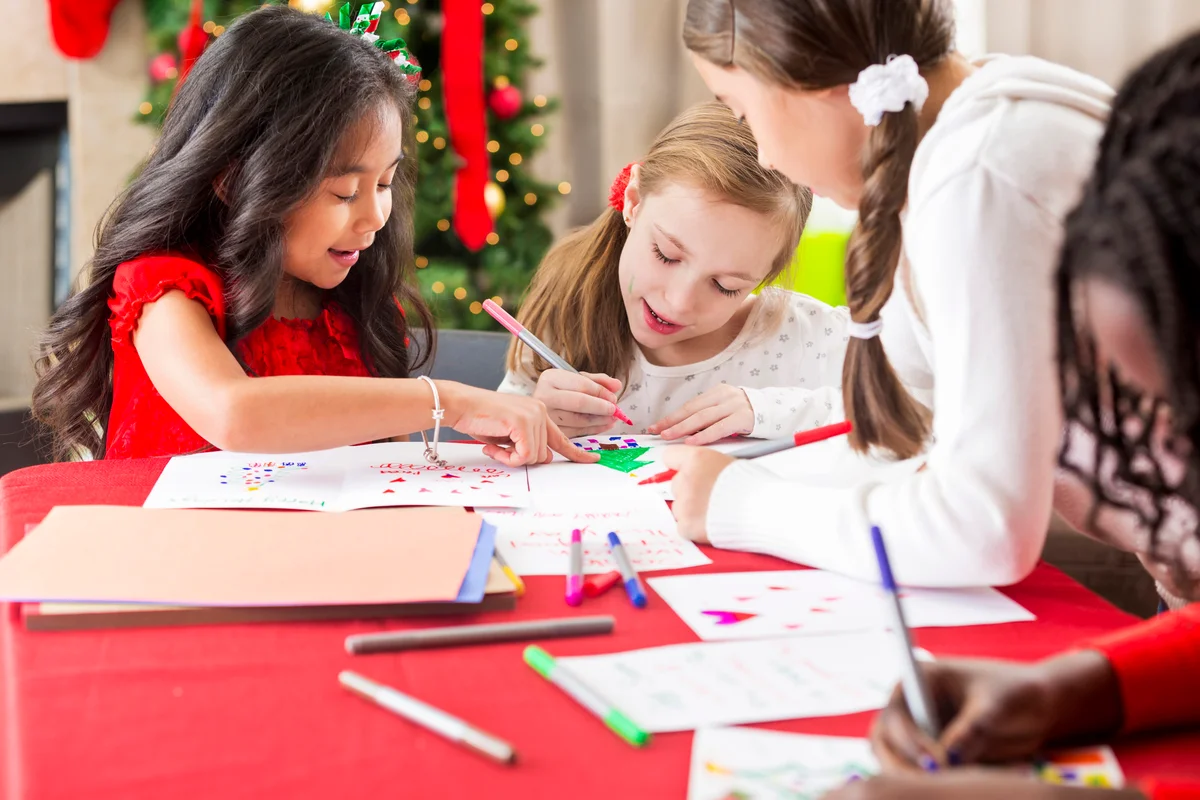 Girls making Christmas cards