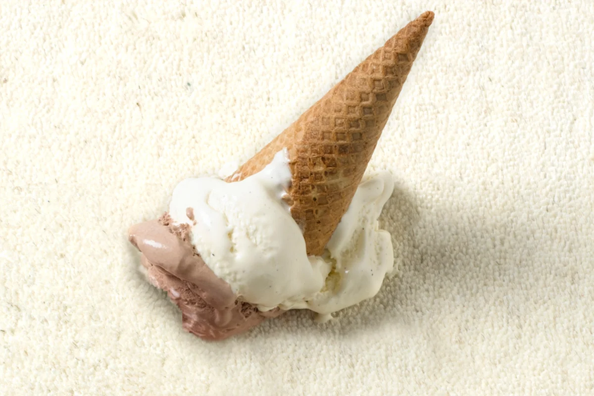 Fake ice cream spill on white carpet