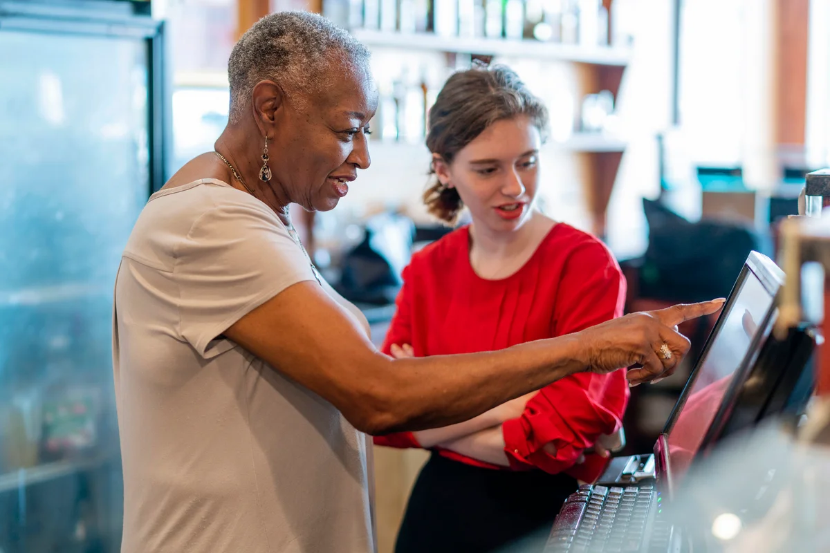 Business owner teaching the new employee