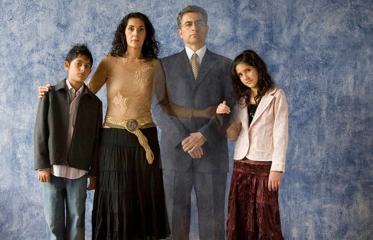 family with ghosted image of father