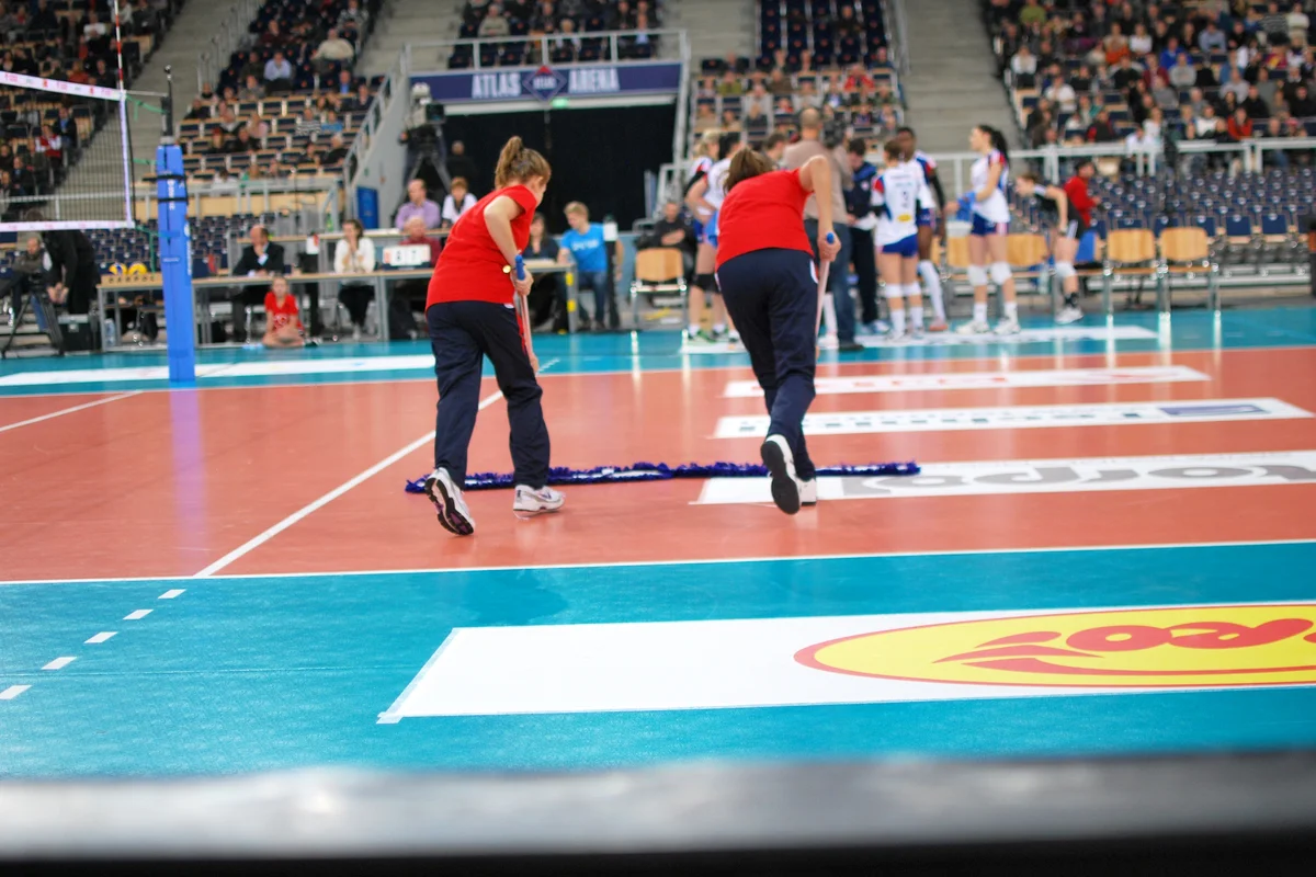 Cleaning the playground during volleyball match